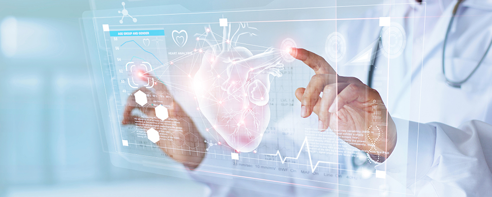 A physician highlights a digital heart on a screen, showcasing advancements in cardiology marketing