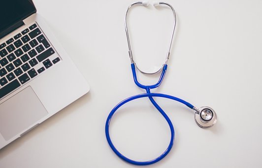 A stethoscope and a laptop representing digital medical marketing 